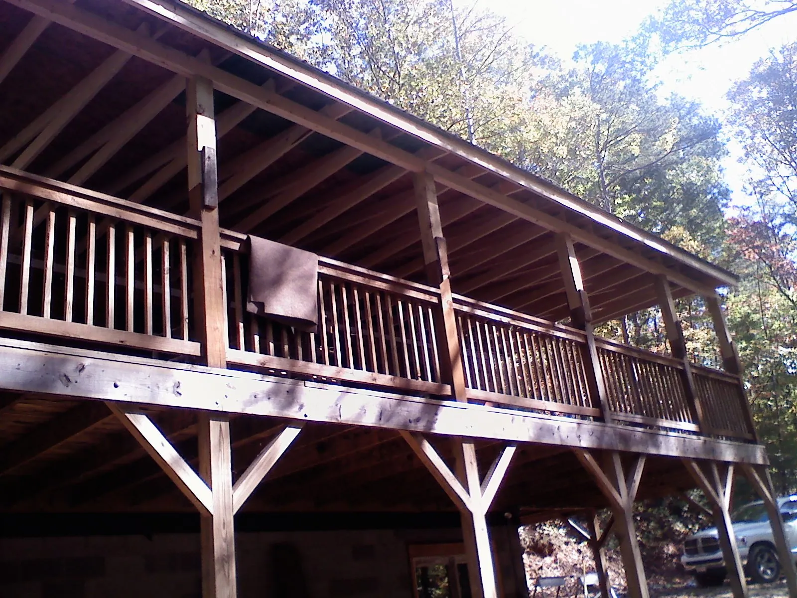Timber framing under a new elevated porch and deck — Roof Leak Repair in Goodrich by Roofing Brothers